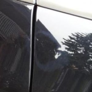 Buffed through the clearcoat to expose the basecoat