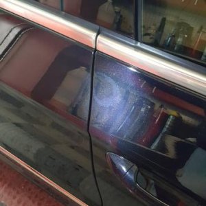 Buffed through the clearcoat to expose the basecoat