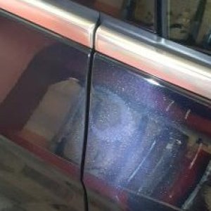 Buffed through the clearcoat to expose the basecoat