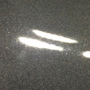 tiny pits in car paint