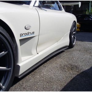 SideSteps_-_Mounts_on_bottom_of_side_skirt_-SpecSFullAeroKitRX7