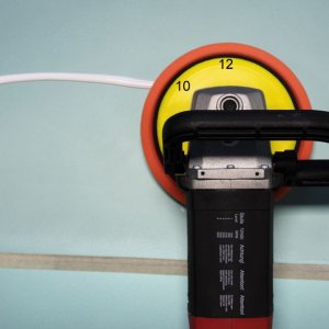 Picking up a bead of product with a rotary buffer