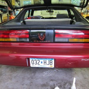 Dealer sticker and before-and-after of taillights