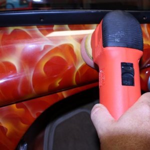 Machine waxing a car dash by Mike Phillips