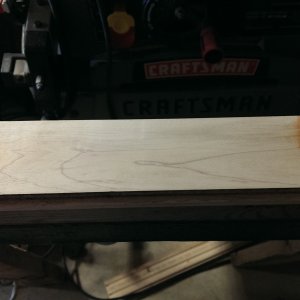 Board after light sanding with belt sander to take finish off