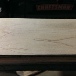 Board after light sanding with belt sander to take finish off