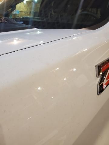 2021 Chevy Silverado with stains in white paint