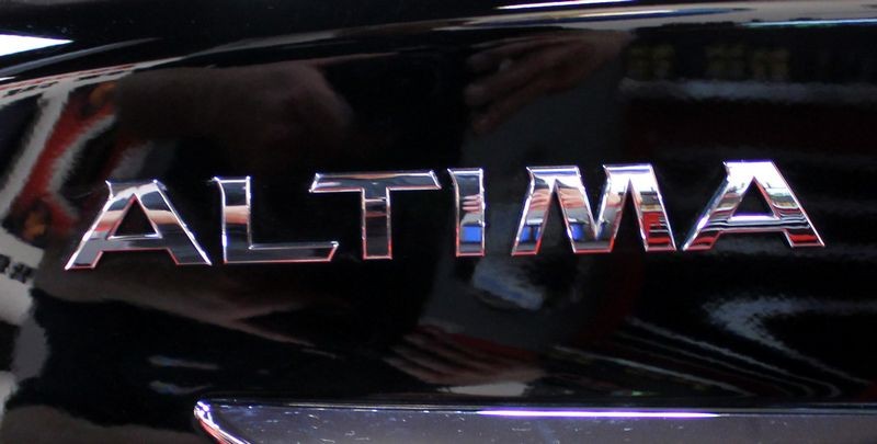 Black BMW Z3 and Black Nissan Altima Detailing Black Paint