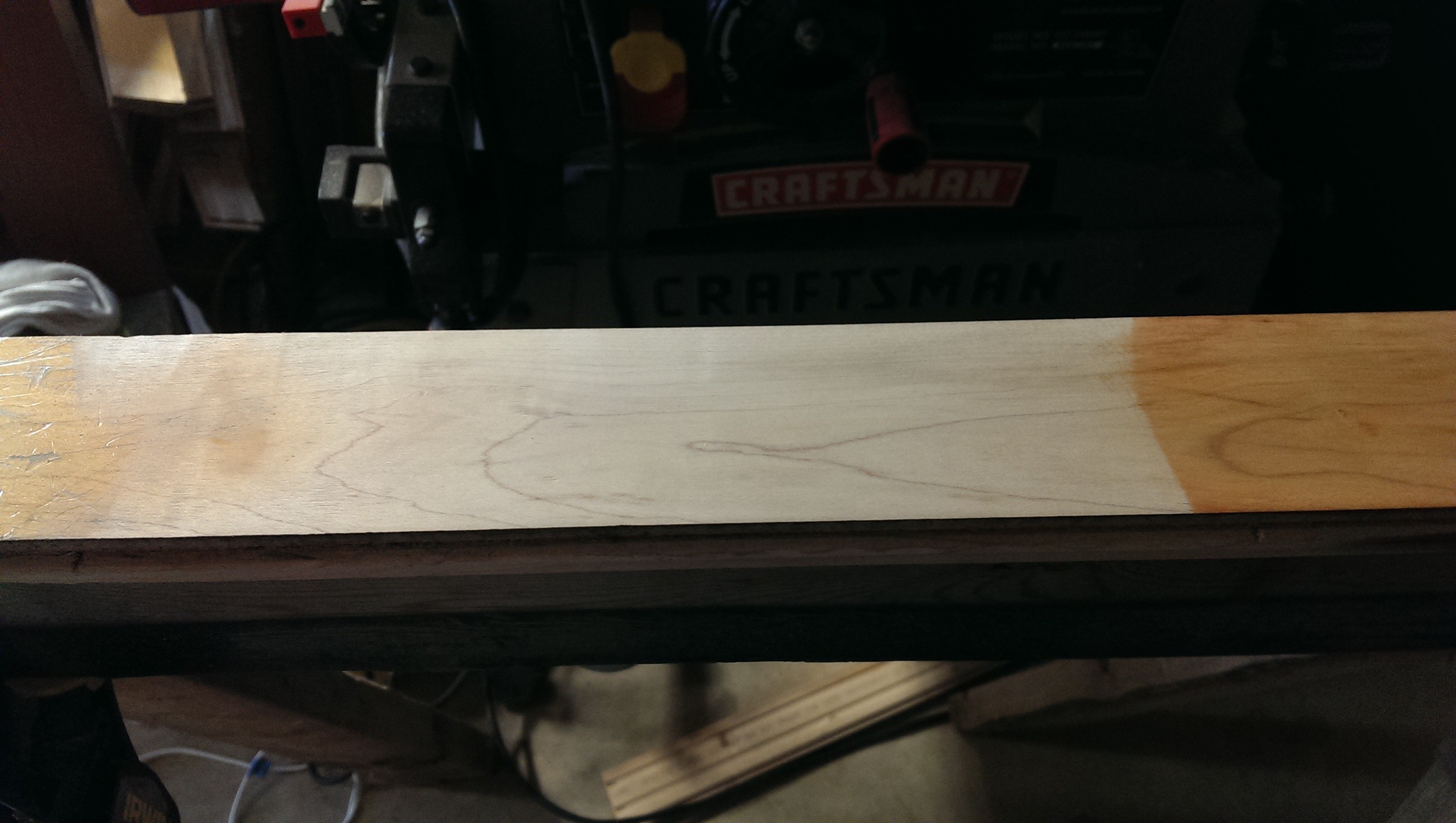Board after light sanding with belt sander to take finish off