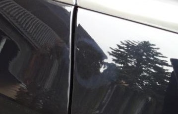 Buffed through the clearcoat to expose the basecoat
