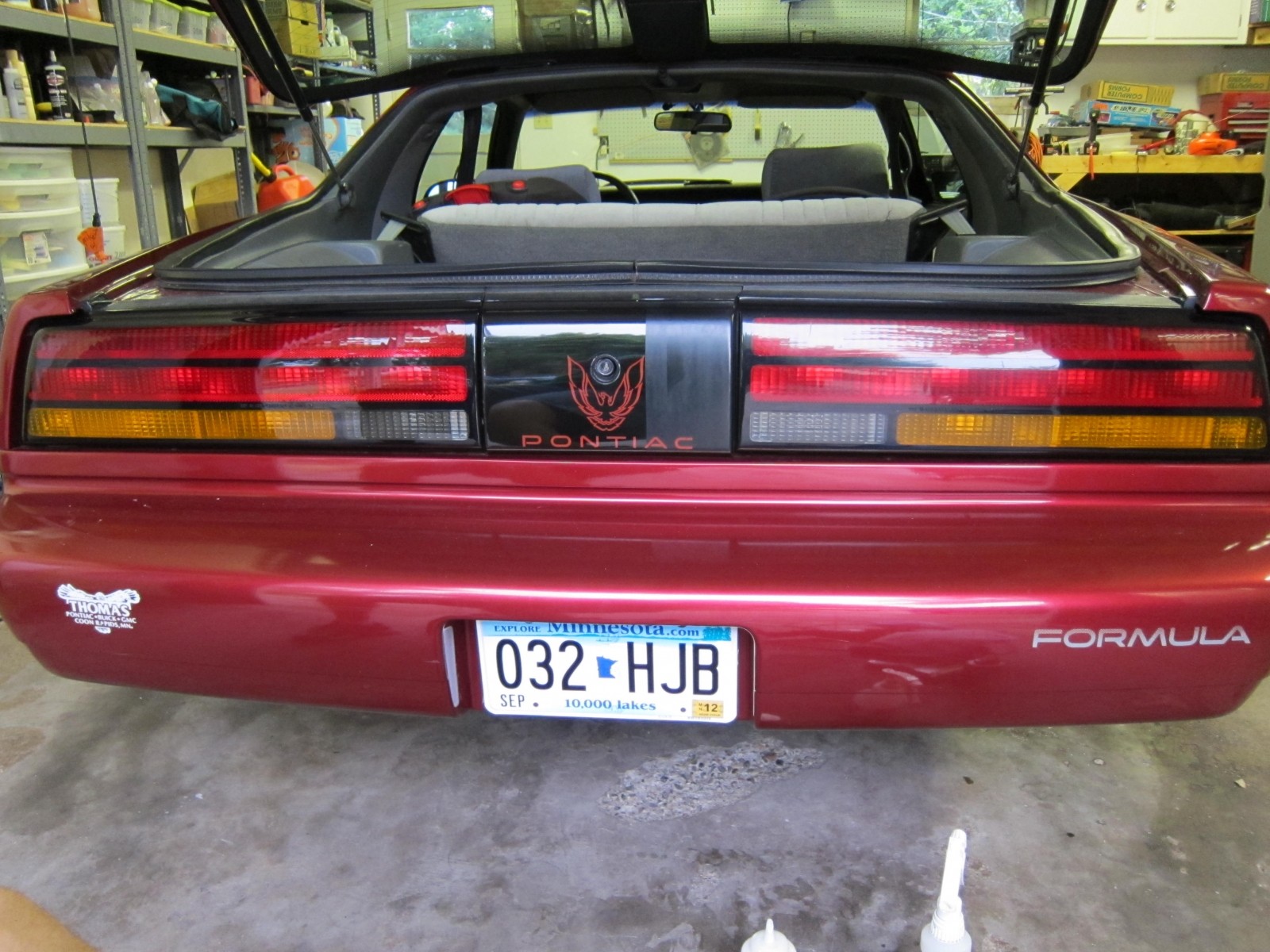 Dealer sticker and before-and-after of taillights
