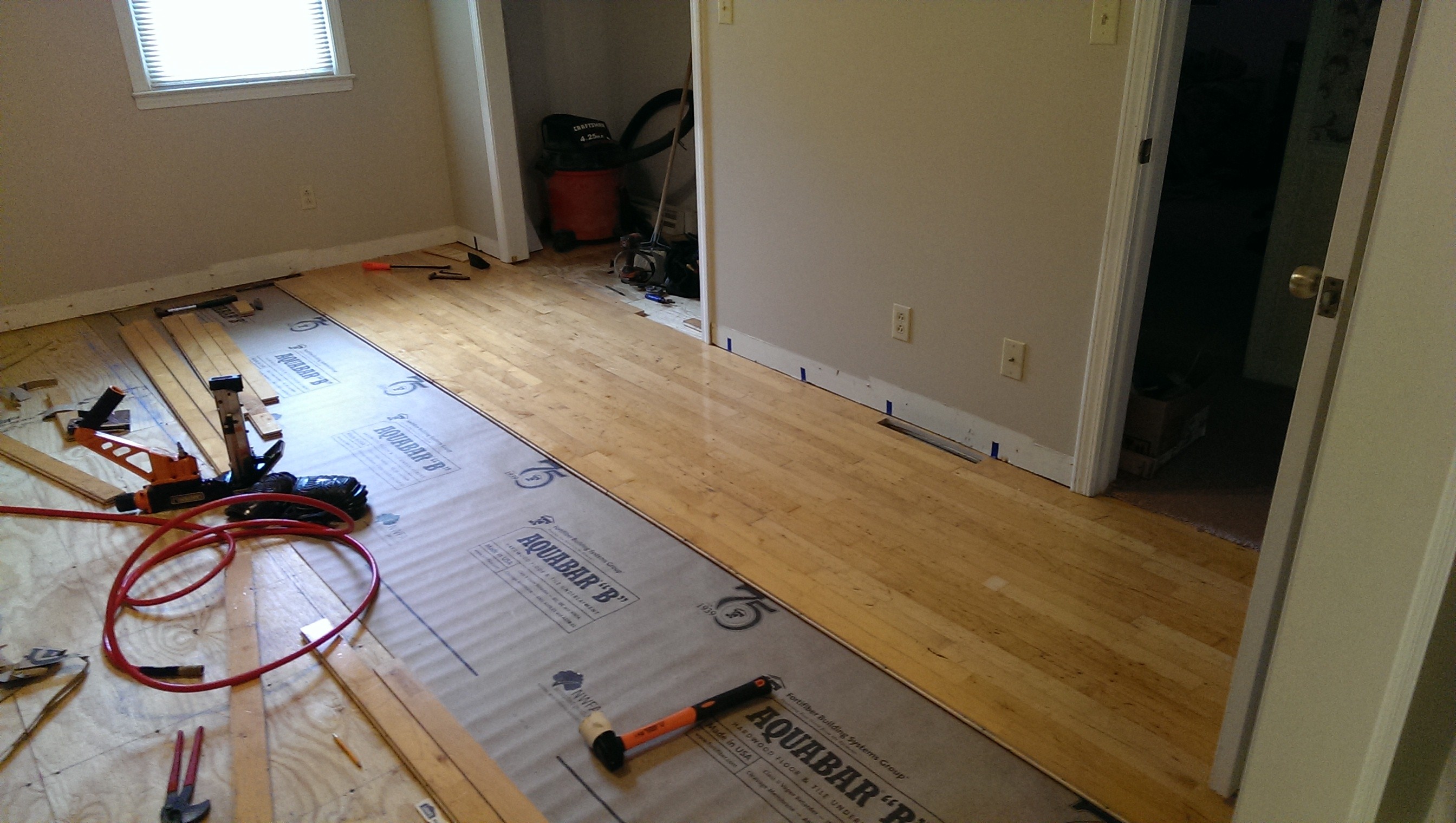 laying down floor in first room