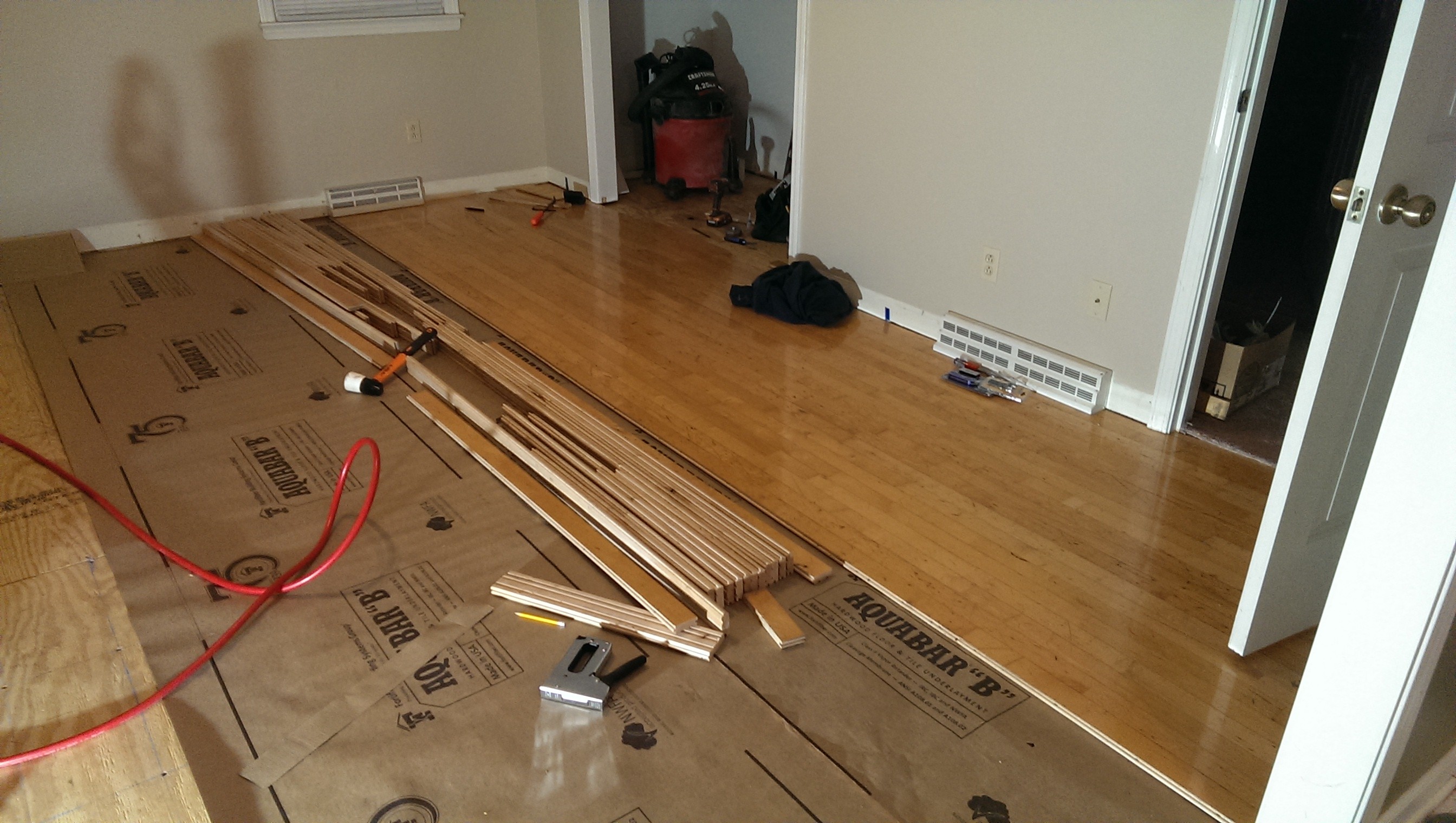 laying down floor in first room