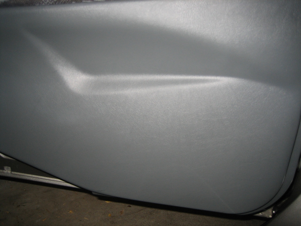 Lower grey panel on door after protectant has dried