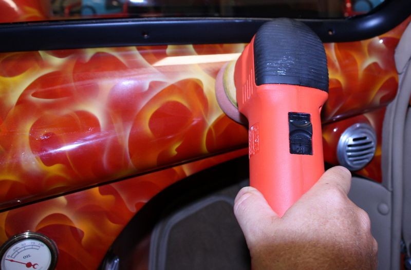 Machine waxing a car dash by Mike Phillips