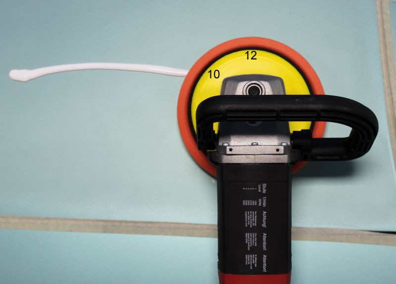 Picking up a bead of product with a rotary buffer