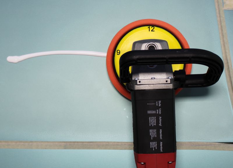 Picking up a bead of product with a rotary buffer