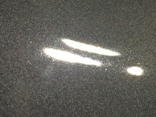 tiny pits in car paint
